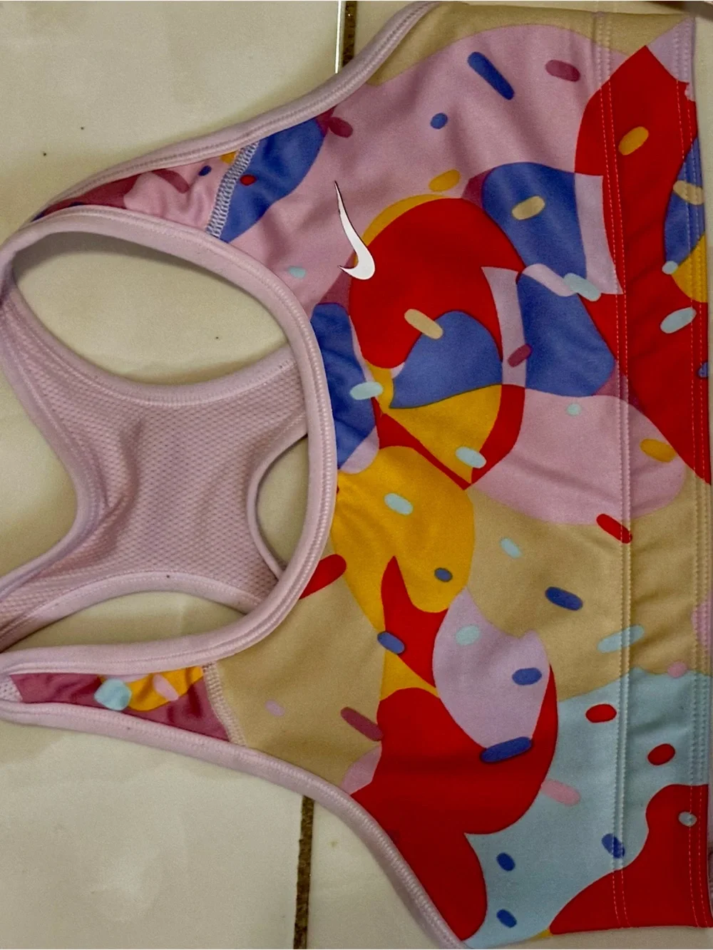 Nike Light Pink Racerback Sports Bra with White Swoosh